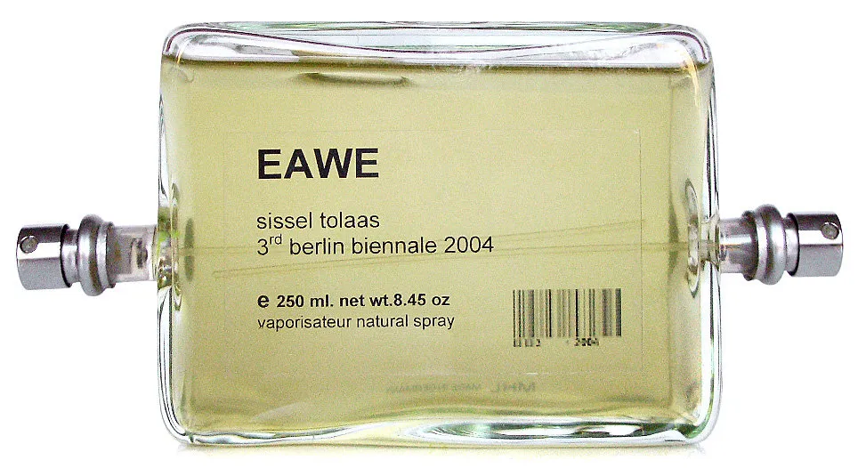 A perfume bottle labeled EAWE, sissel tolaas, 3rd berlin biennale 2004, with two metal spray nozzles at its left and right edges.