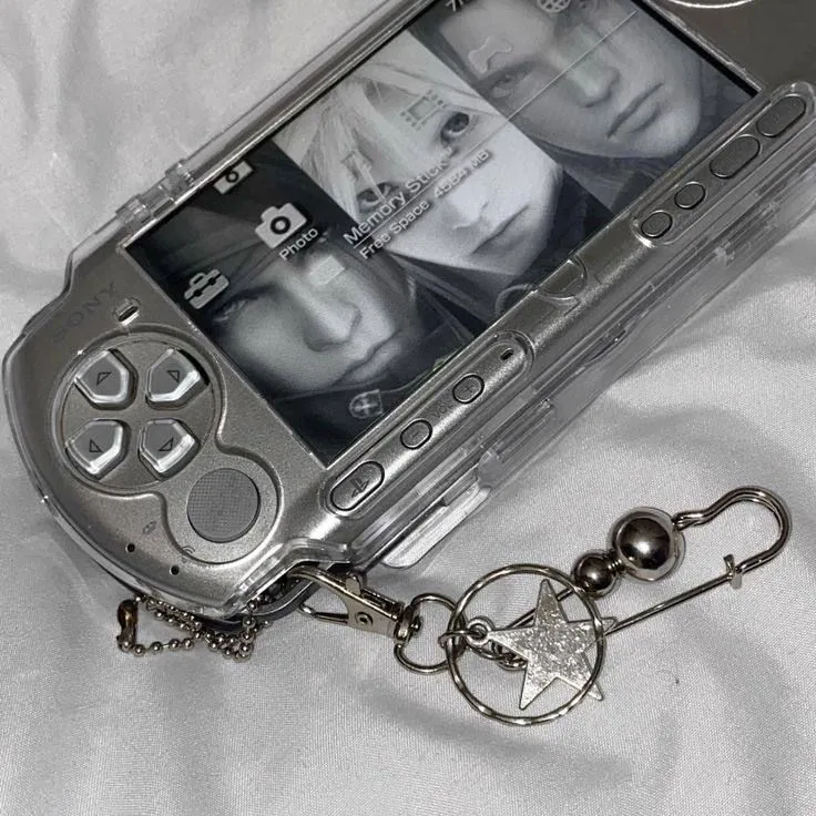 Close-up of a mint green clear PSP-3000 shell, angled on a display stand.
