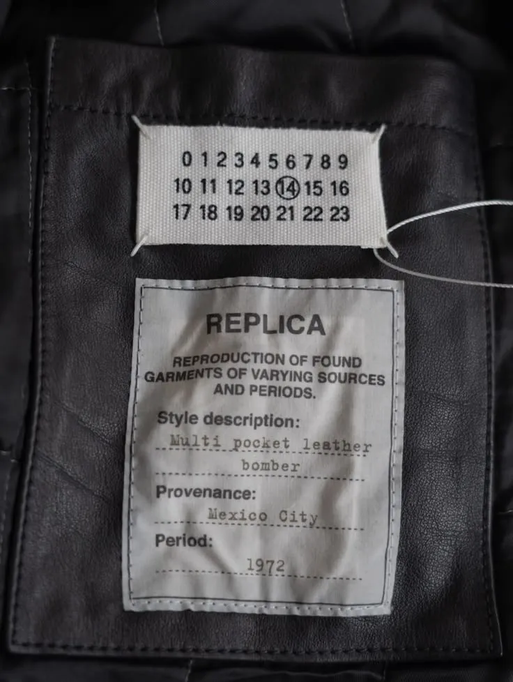 Margiela numerical tag with 14 circled, on a Replica label.