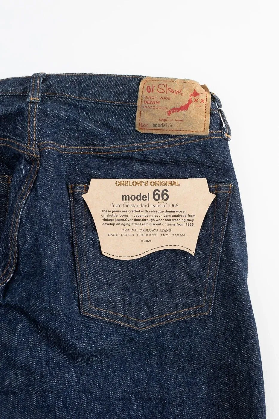 orSlow model 66 jeans, showing a kraft-paper style leather patch and a cream flasher on the back pocket.